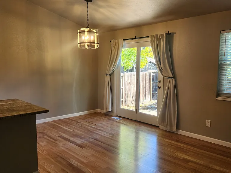 Dining area with large french doors to exterior.
