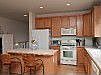 Kitchen w/HW Floors 42" Cabinets,Island & Gas Stove