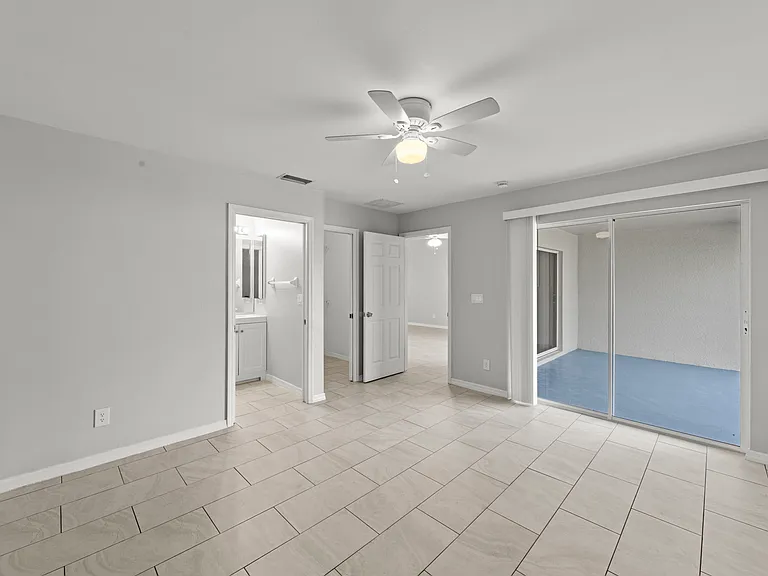 Master bedroom with access to rear screened lanai