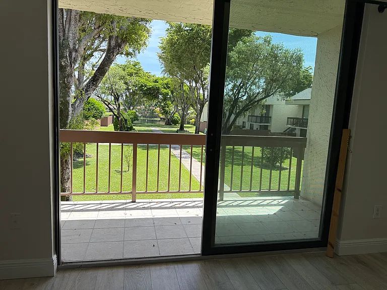 Impact window door on the covered balcony facing east