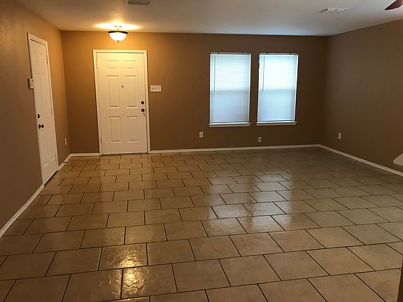 Front door and garage door to left.