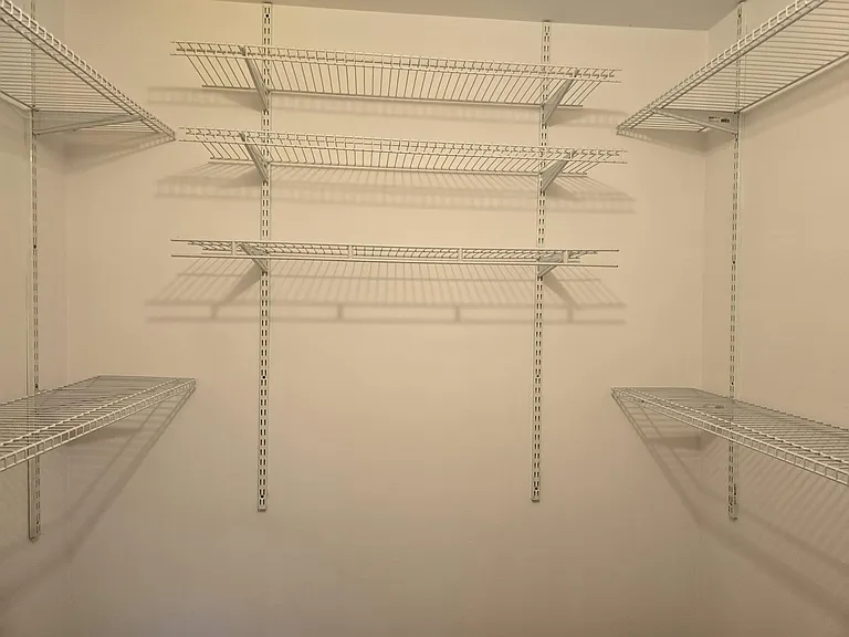 One of Two Walk-In Closets