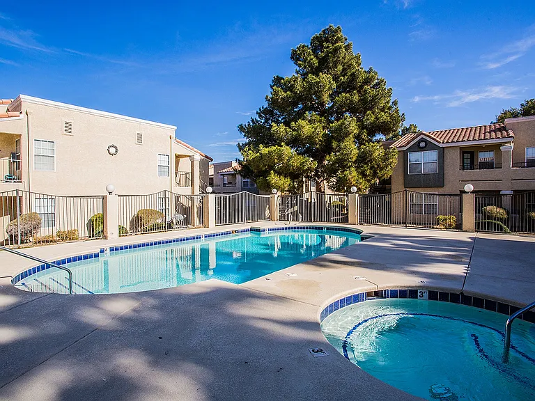 Relax at this serene apartment community featuring a refreshing pool and luxurious hot tub.