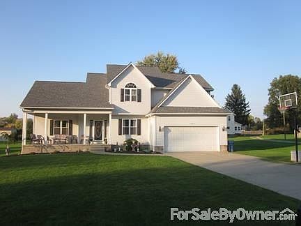 front of house with basketball hoop