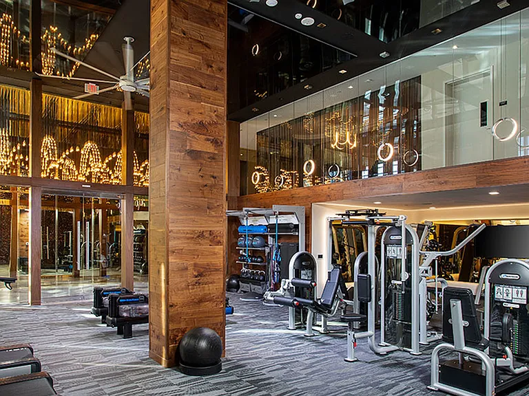 Expansive HIIT-inspired fitness center with cardio and weight stations