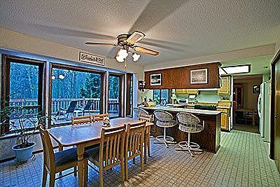 Dining nook is sunny and bright with solarium type windows for pleasant view