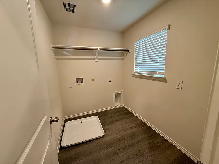 Utility room with washer and dryer hookups