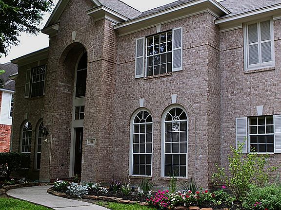 Beautiful exterior as well as interior..Arched windows, double door entry into a  2  story w extended marble in foyer