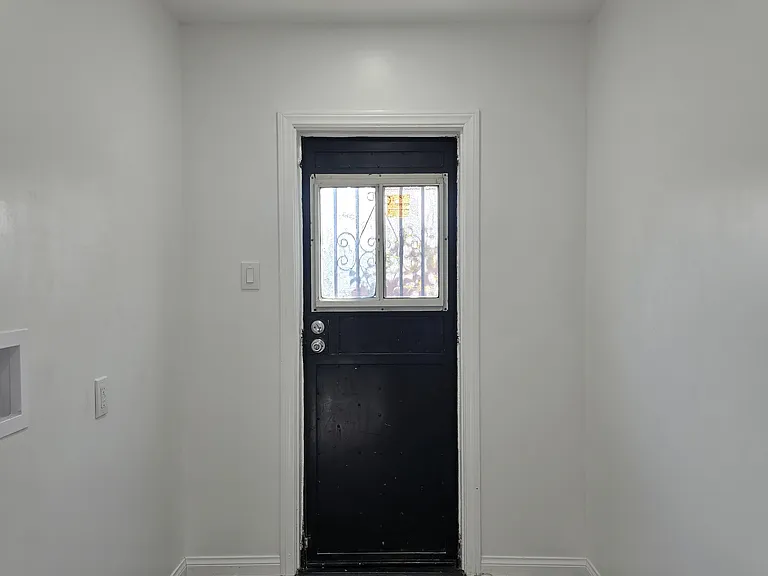 SERVICE PORCH FOR WASHER/DRYER WITH ENOUGH SPACE FOR YOUR LAUNDRY NEEDS