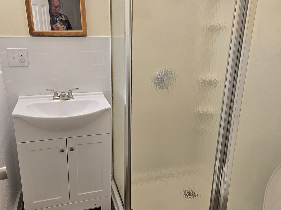 Bathroom with shower, new sink and vanity.