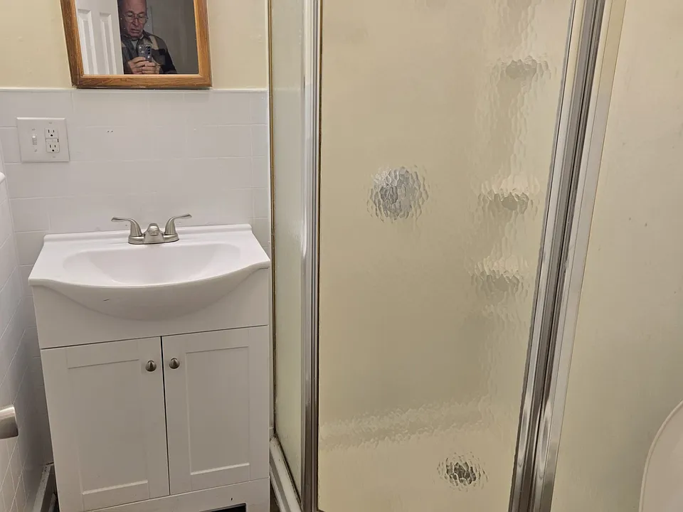 Bathroom with shower, new sink and vanity.