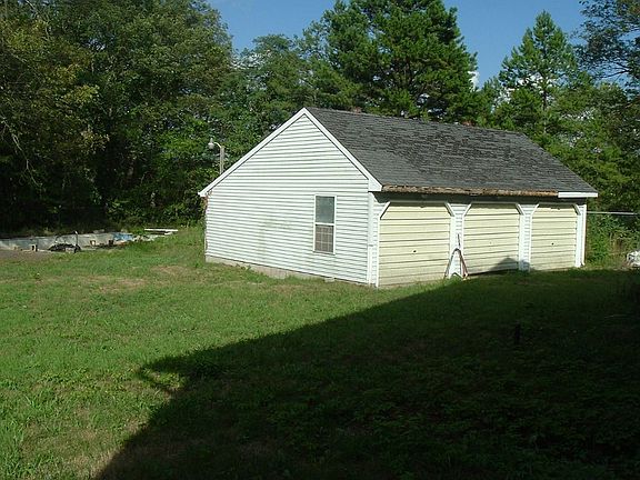 3 car detached garage in fenced yard