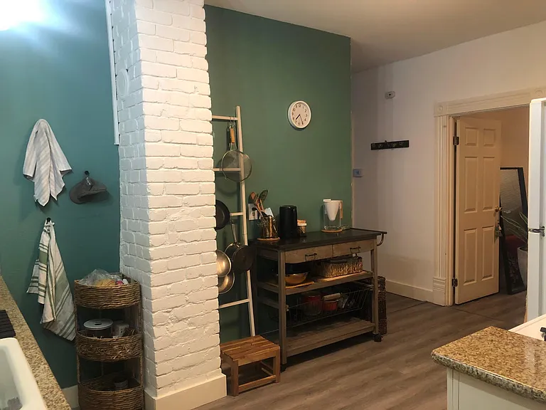 Kitchen, and view of master bedroom door