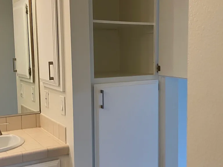 Bath, linen storage in master bath 1