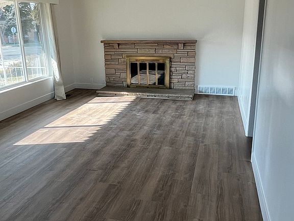 family room, new luxury wood vinyl flooring throughout entire house