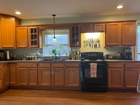 Hardwood floors and large kitchen.