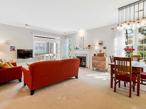 Light-filled end unit with cozy wood-burning fireplace