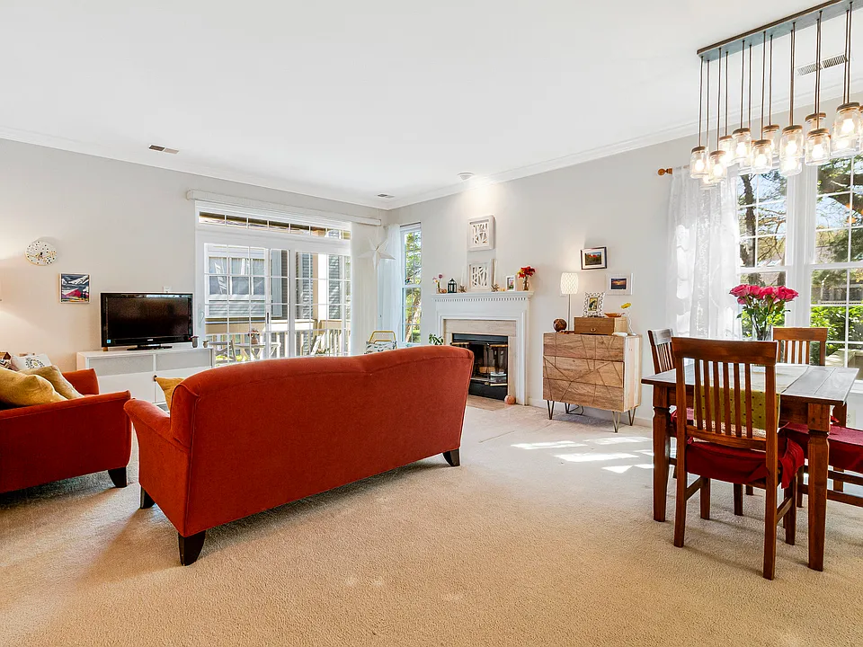Light-filled end unit with cozy wood-burning fireplace