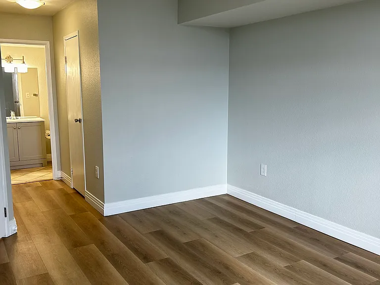 Primary Bedroom view of hall to walk in closet and en suite.