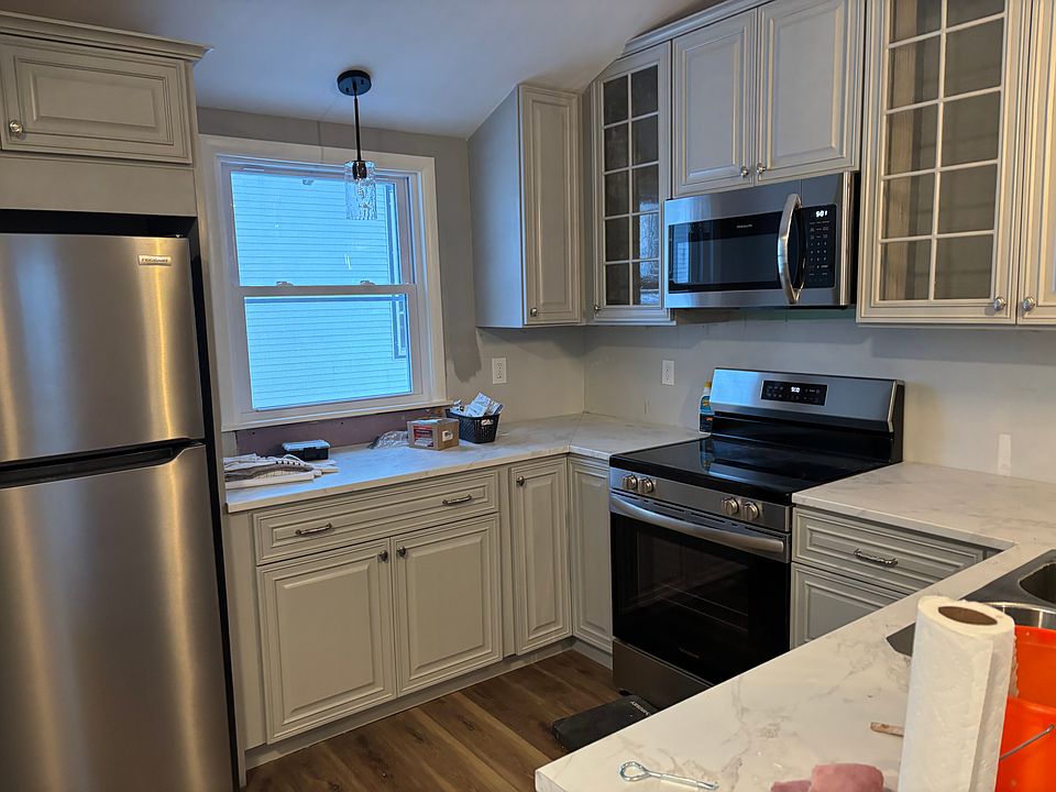 Kitchen with new appliances; large pantry on left is not shown.