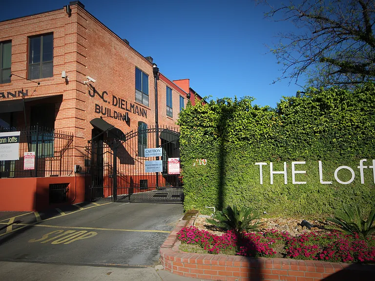 Building front view and gated parking entrance