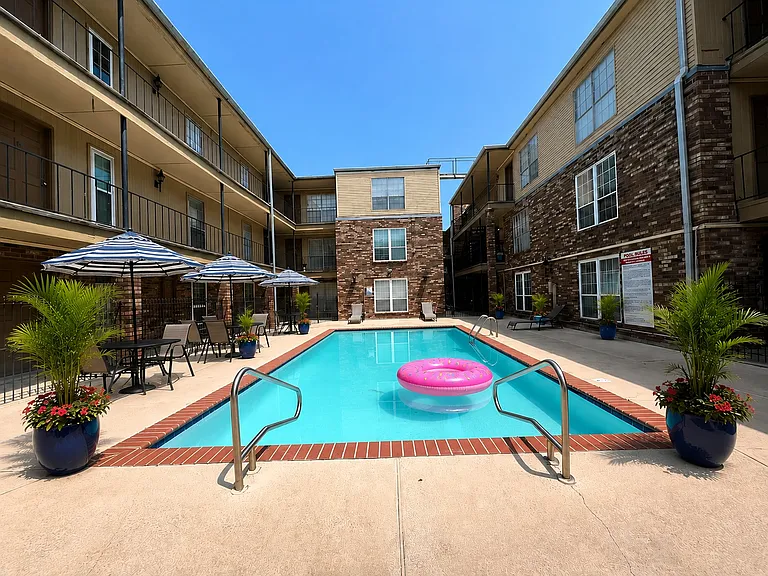 Enjoy sunny afternoons at the community pool, conveniently located just steps from the condo.