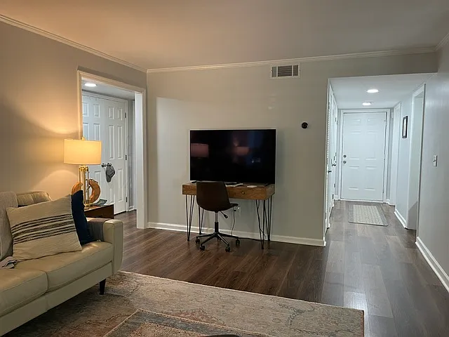 View of foyer from living area. Kitchen is to the right.