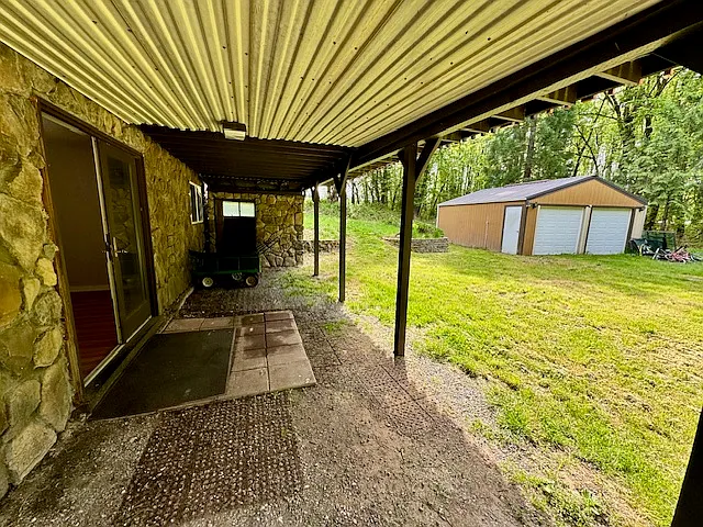 Storage shed included.