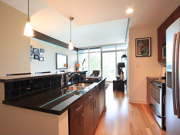 The kitchen features granite countertops and stainless appliance package.