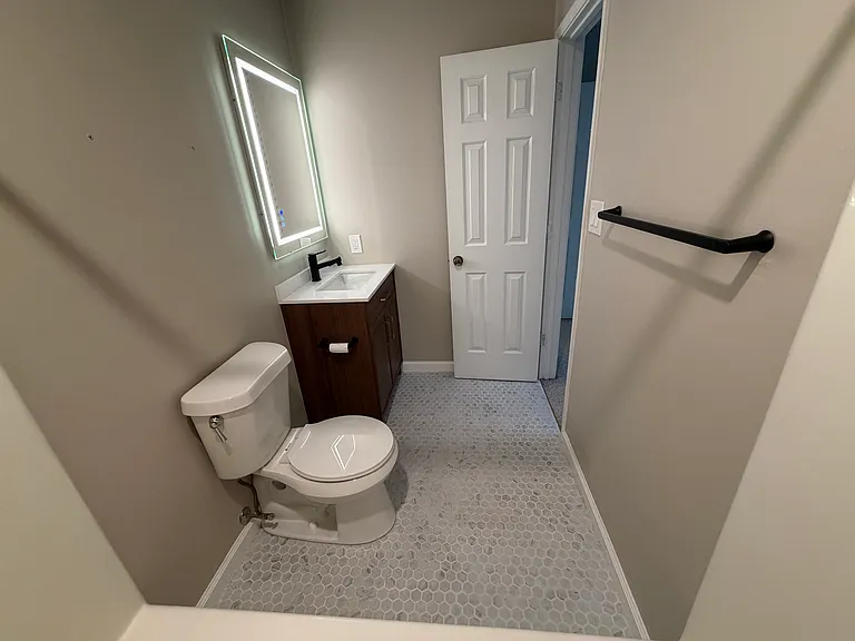 The front bedroom's Bathroom with a tub