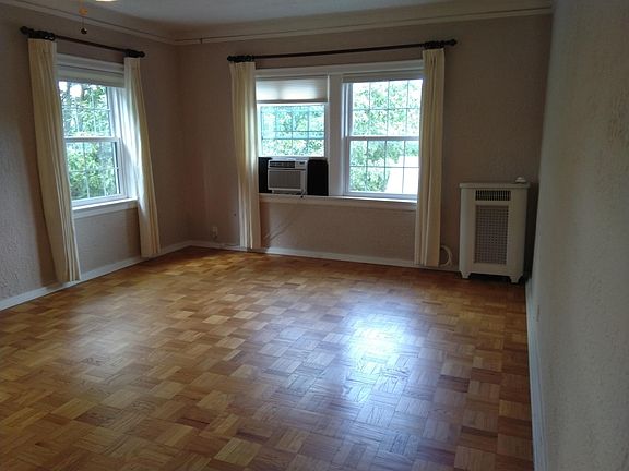 The LARGE 14 x 20 living room has great east and north views. It feels like you're living in the tree tops. This is the view to the East primarily.