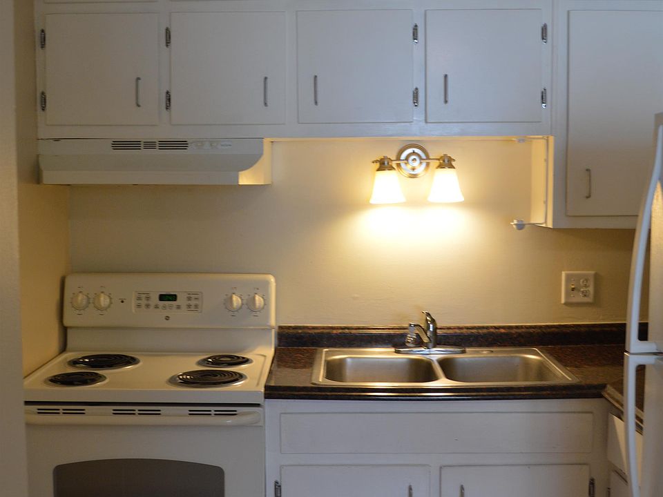 This kitchen has an abundance of cabinetry and storage