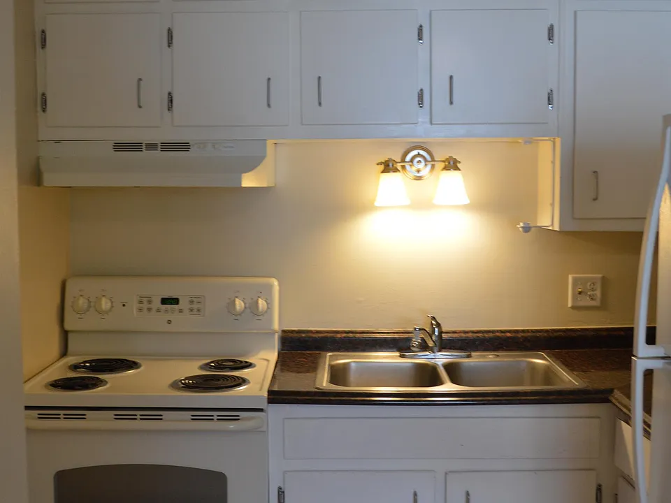This kitchen has an abundance of cabinetry and storage