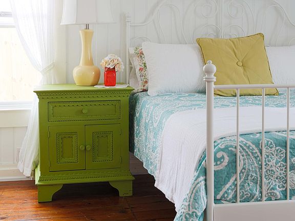 Queen Bed with memory foam mattress that is encased in a protective cover.