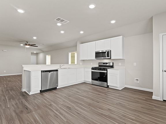 Kitchen and Dining Area to Family Room