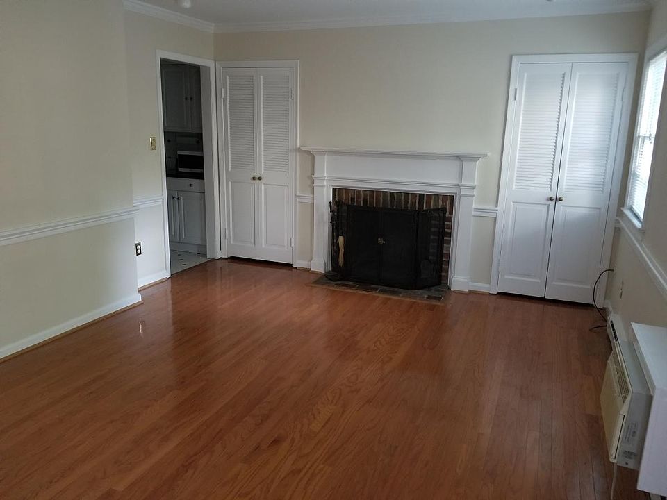 Living room w/ hardwood and fireplace