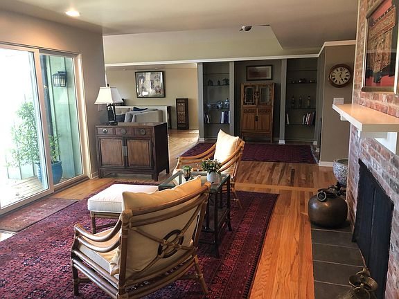 Comfortable sitting room just off the patio with views of backyard. Central heating and AC!