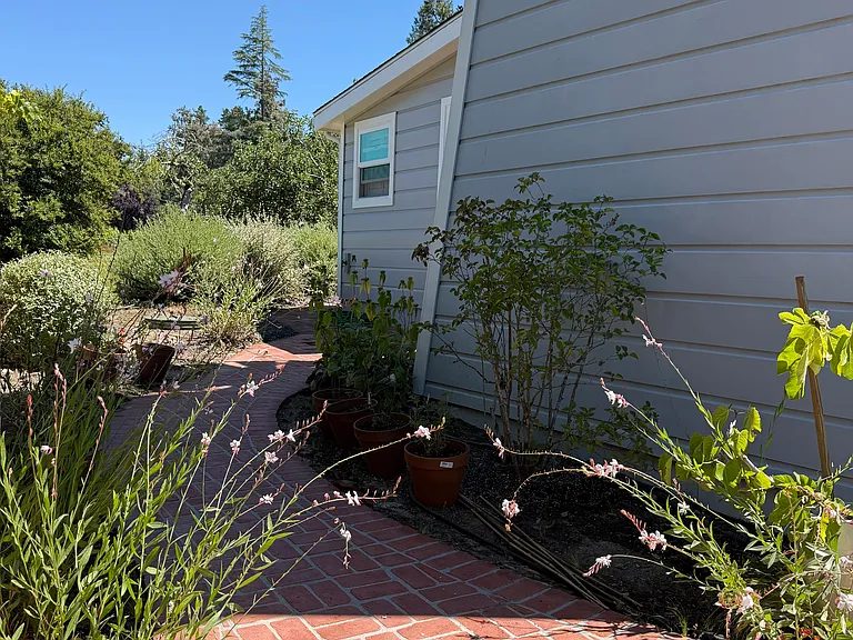 Walkway around tower to the master bedroom outdoor Patio area, with direct opening from master bedroom as well