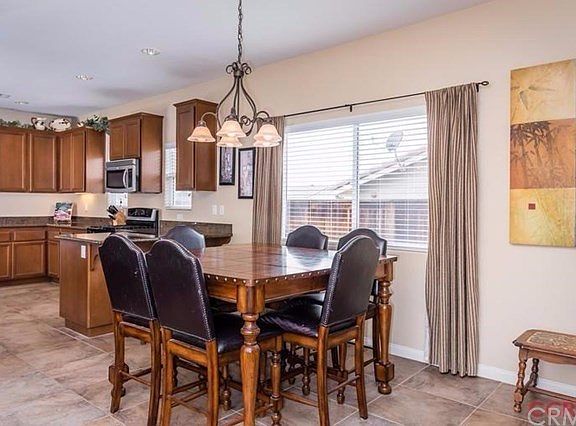 There is plenty of room for a large dining room table and bar stools at the kitchen counter. Easy li