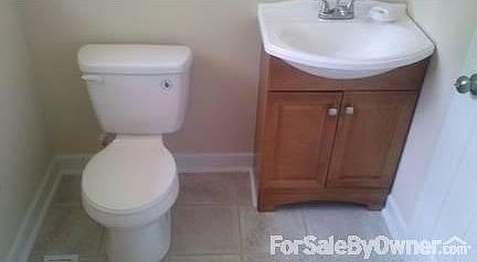 Stylish bathroom : Completely new bathroom with tile floors, new sink, tub and toilet.