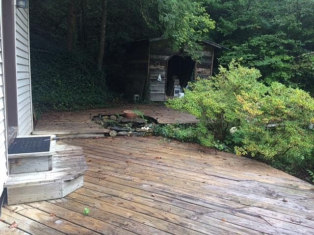 Decks surround 3 sides of house.