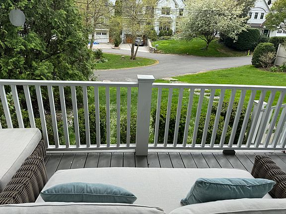 Front porch overlooking private court where kids scooter/bike and play