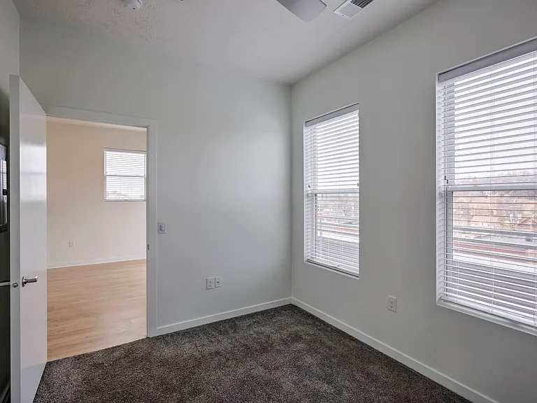 Large windows in a bedroom at The Rise.