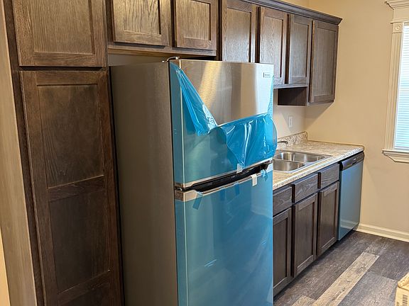 Brand new Stainless Frigidaire appliances and cabinets.
