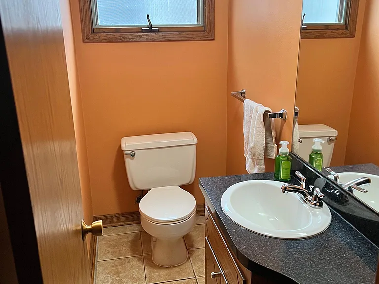 half bathroom off garage and kitchen.