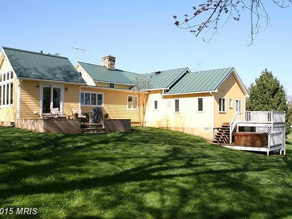 back of house and hot tub