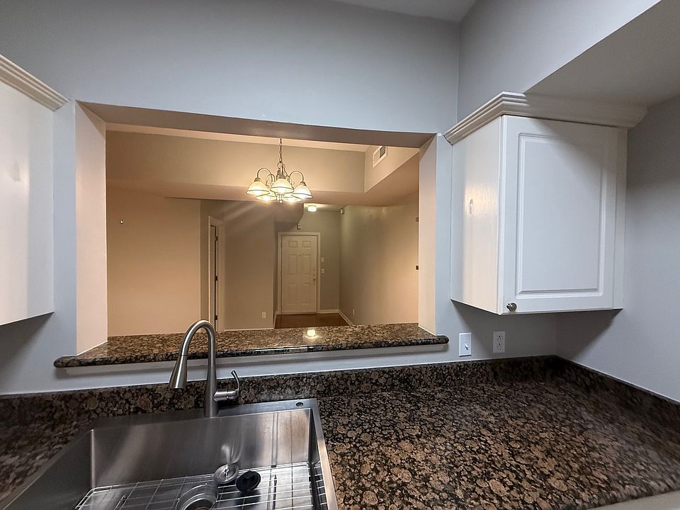 View from kitchen to dining room and front door.