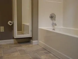 Bathroom paint coordinates with flooring.