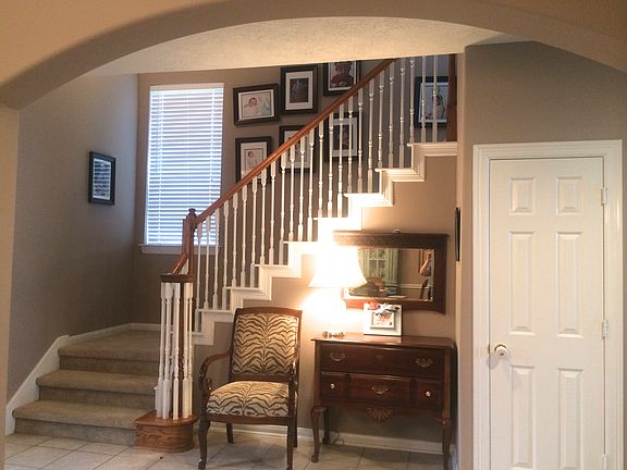 staircase with entryway cove