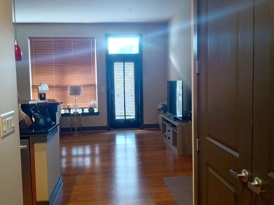 Hallway. On the right a closet with a full-size washer and dryer